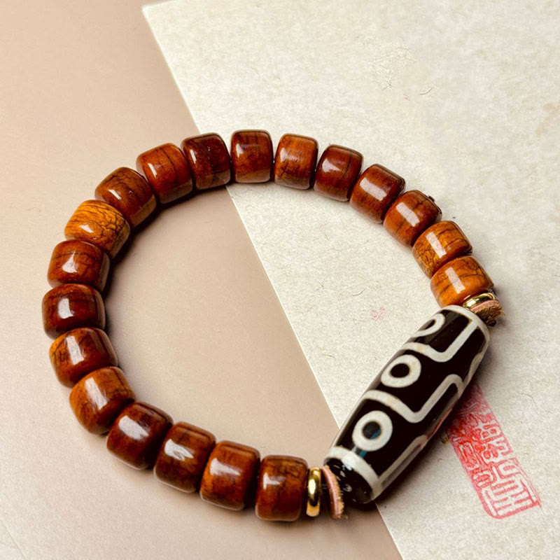 KarmaRipple's Tibetan Yak Bone Nine-Eye Dzi Bead Protection Bracelet p1