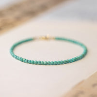 KarmaRipple's 2mm Turquoise Ultra-thin Beadwork 14k Gold Plated Bronze Wisdom Bracelet