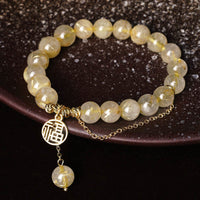 Bracelet du bonheur en citrine de KarmaRipple, personnage de Fortunate Fu
