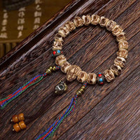 KarmaRipple's Tibetan Camel Bone Garuda Carved Protection Tassel Bracelet
