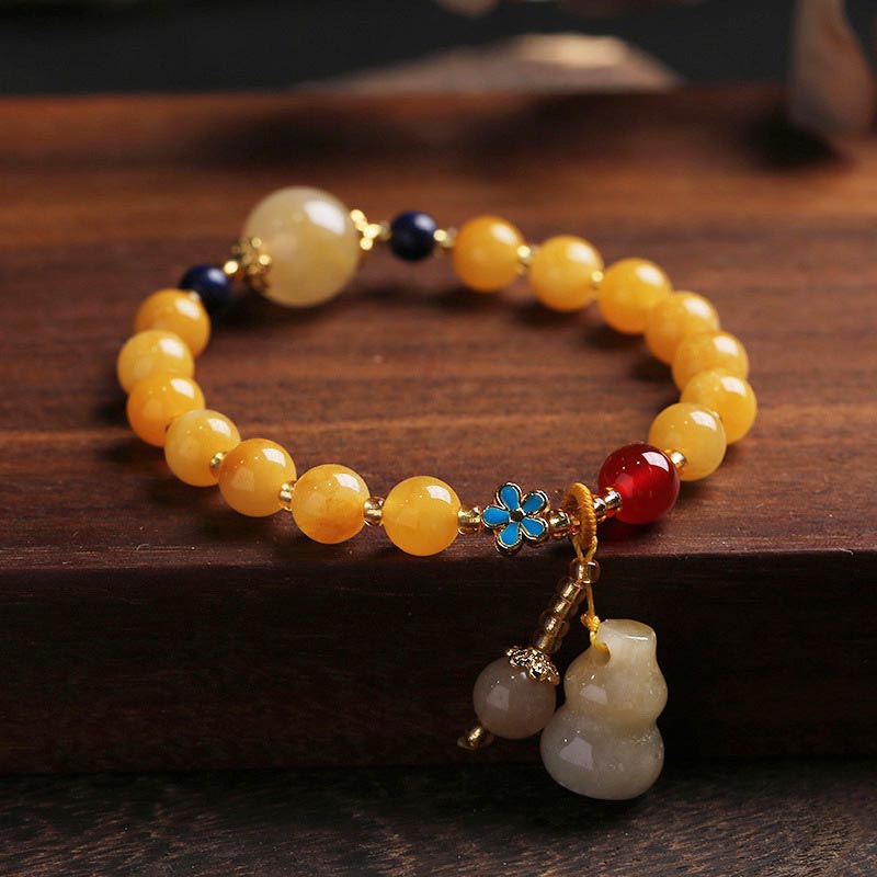 KarmaRipple's Authentic Golden Silk Jade Gourd Talisman Wealth Fortune Bracelet p1