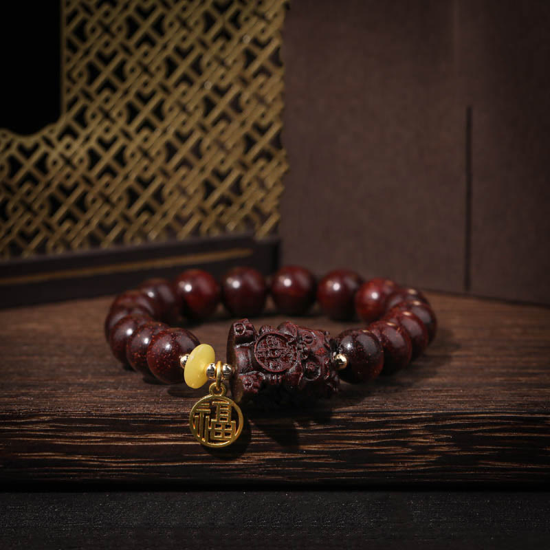 KarmaRipple's Small Leaf Red Sandalwood Gold Swallower Calm Bracelet p1