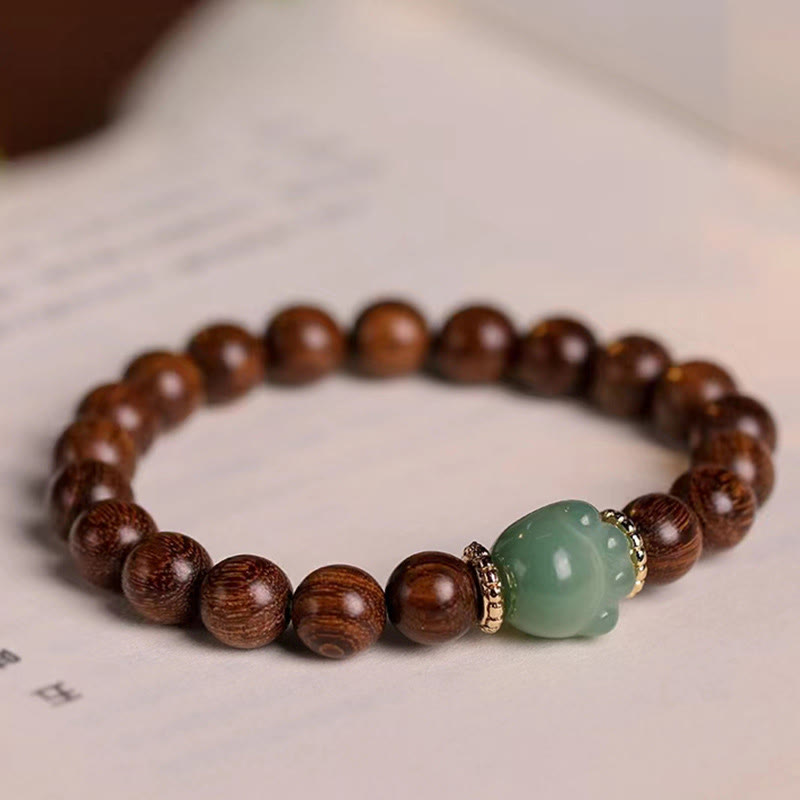 KarmaRipple's Sandalwood Lovely Cat Paw Protection Bracelet p1