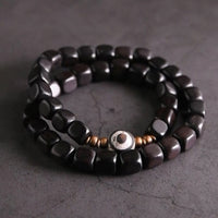 KarmaRipple's Ebony Wood Dzi Bead Bronze Peace Pair Bracelet