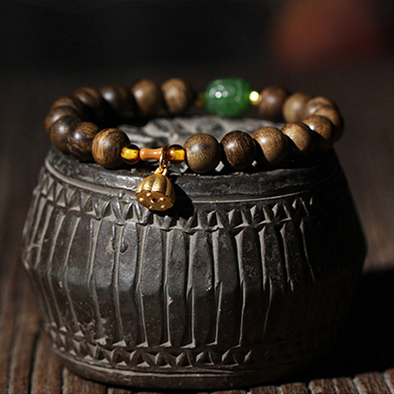 KarmaRipple's 999 Gold Brunei Agarwood Cyan Jade Lotus Flower Peace Strength Bracelet p1