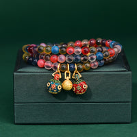 Bracelet triple tour en agate bonbon colorée et dorée de KarmaRipple, talisman de force familiale, bête avaleuse