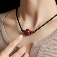 Collier pendentif en perles de cinabre de KarmaRipple avec cordon de bénédiction