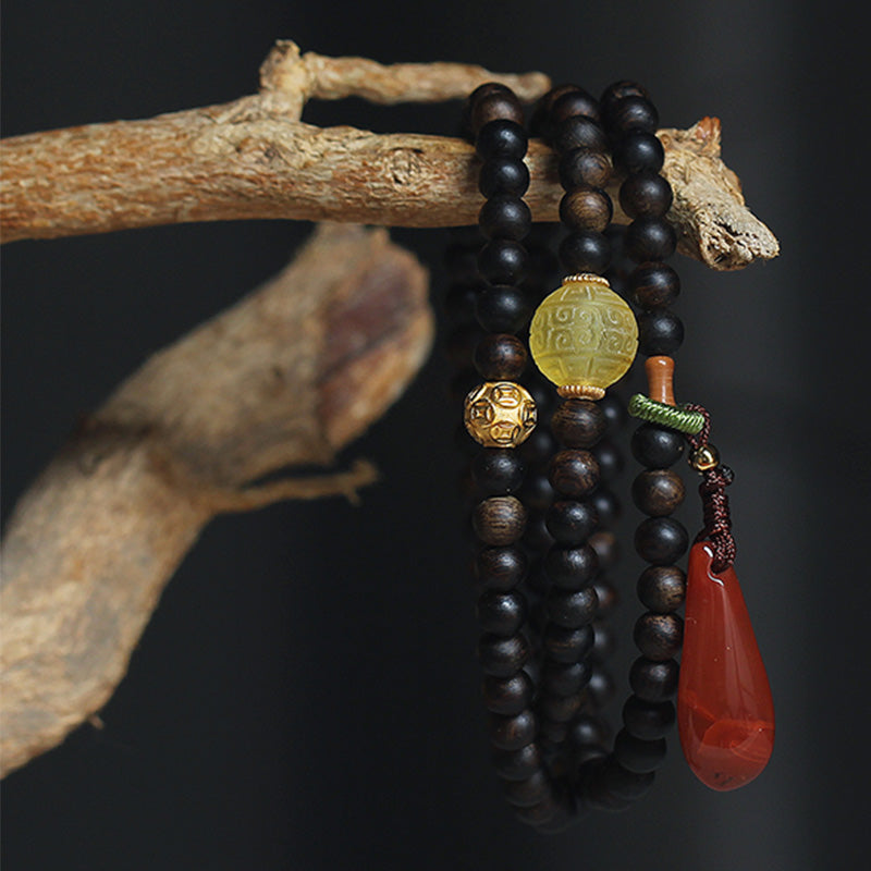 KarmaRipple's 999 Gold Nha Trang Heiqinan Agarwood Amber Red Agate Strength Meditation Bracelet p1