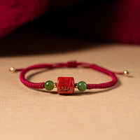 KarmaRipple's Tibetan Cinnabar Om Mani Padme Hum Engraved Blessing Woven Rope Bracelet