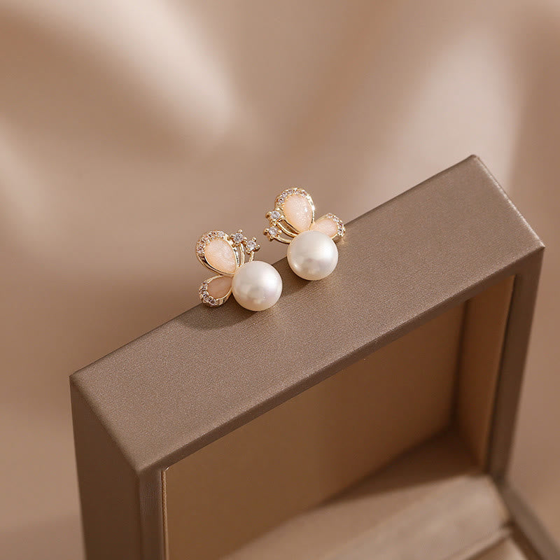 KarmaRipple's 18K Gold Pearl Butterfly Love Freedom Stud Earrings p1