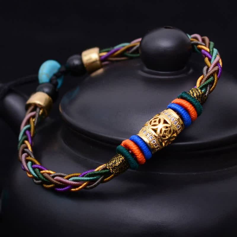 KarmaRipple's Tibetan Handmade Eight Thread Weave Bronze Coin Fortune Weave String Bracelet p1