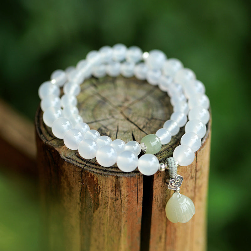 KarmaRipple's Ivory Agate Jade Lotus Protection Bracelet p1