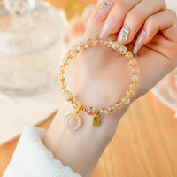 KarmaRipple's Authentic Golden Rutilated Quartz Fu Character Peace Buckle Talisman Wealth Bracelet