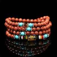 Bracelet de confiance en perles de 108 Mala Goldstone Om Mani Padme Hum Swastika de KarmaRipple